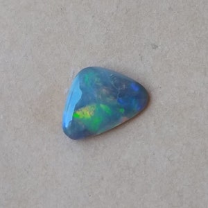 Dark Opal #476 Solid 0.85 Carat Bright Blue, Green, Orange, measuring 10 x 7 x 2mm from Lightning Ridge the perfect opal for a pendant