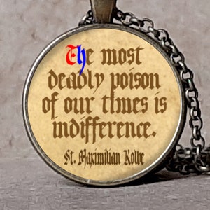 May include: An antique bronze bezel necklace with a round pendant. The pendant features a quote: "The most deadly poison of our times is indifference." The text is in a vintage font. The necklace is also available in antique silver.