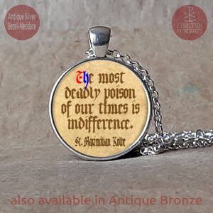 May include: Antique silver pendant necklace featuring a circular pendant with a quote: "The most deadly poison of our times is indifference." The text is in a vintage style font. The necklace is also available in antique bronze.