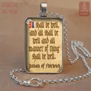 May include: Antique silver necklace with a rectangular pendant. The pendant features a quote from Julian of Norwich: "All shall be well, and all shall be well and all manner of thing shall be well." The text is in a vintage style font.
