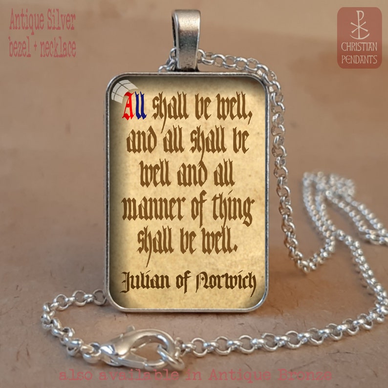 May include: Antique silver necklace with a rectangular pendant. The pendant features a quote from Julian of Norwich: "All shall be well, and all shall be well and all manner of thing shall be well." The text is in a vintage style font.