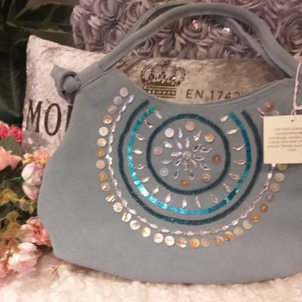 New Torba leather sky blue grab bag with tags. Beautiful hand decorated bag and in excellent new condition with gorgeous detailing x