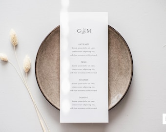 May include: A white menu card with the text "G & M" and a small leaf design at the top. The menu lists "Antipasti", "Primo", "Second", and "Dessert" with placeholder text for each course.