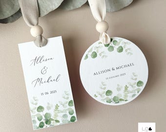 May include: Two wedding favor tags with a green watercolor eucalyptus design. One tag is rectangular and says "Allison & Michael 15 06 2025". The other tag is round and says "Allison & Michael 15 Giugno 2025".