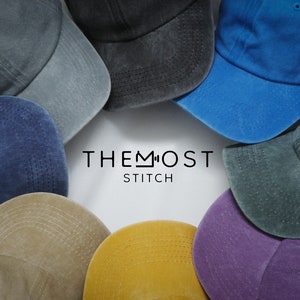 May include: A collection of baseball caps in various colors, including blue, gray, and yellow, arranged in a circular pattern. The caps have a worn, vintage look. The text "THE MOST STITCH" is centered in the image.