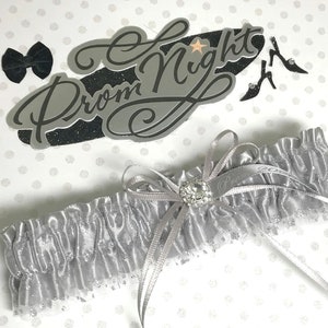 Silver senior prom garter.   Silver prom garter.