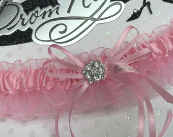 Medium pink prom garter.