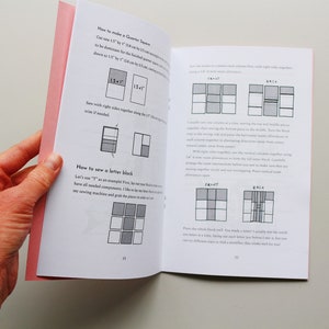 May include: A book with instructions on how to make a quilt block. The book has a pink cover and is open to a page with diagrams showing how to sew the pieces together. The text on the page reads "How to make a Quarter Square" and "How to sew a letter block".