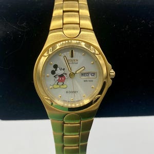 May include: A handmade wooden sign with the text "Welcome" in a playful font. The sign is painted white with a distressed finish, and features a decorative floral design in shades of pink and green. Includes a jute rope for hanging.