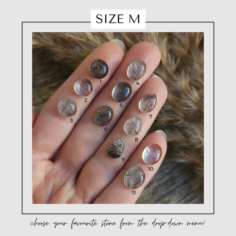 May include: A hand displays eleven oval-shaped gemstones, each with unique internal patterns and colors, numbered 1 through 11. The text "SIZE M" is at the top, and the phrase "choose your favourite stone from the drop down menu!" is at the bottom.