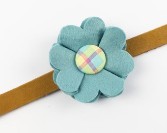 Blue Dog Collar Flower in a wool felt fabric with a bright multicoloured check button