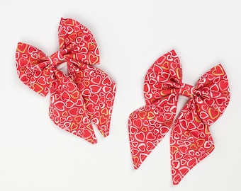 Valentines Sailor Bow in a Red, white and gold metallic love hearts fabric