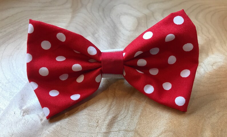 May include: Red bow tie with white polka dots.