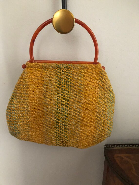 Vintage handwoven purse with orange bakelite handl