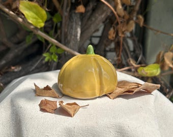 Small yellow ceramic pumpkin