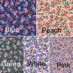 May include: Five fabric swatches with a floral pattern. The swatches are labeled "Blue", "Peach", "Green", "White", and "Pink".