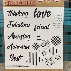 May include: A set of 23 black and white rubber stamps with various words and designs. The words include "thinking", "love", "fabulous", "friend", "amazing", "awesome", "best", "true", "of you", "to my", "you are", "friends", and "wishes". The designs include stars, stripes, and polka dots.