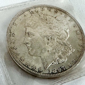 1897 p. Morgan-zilverdollar AU+