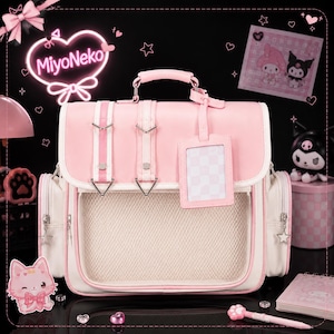 May include: A light pink and white backpack featuring a top handle, two vertical straps with silver buckles, a front mesh pocket, and a matching rectangular ID tag. The bag includes side pockets with star-shaped zipper pulls and a smooth finish.