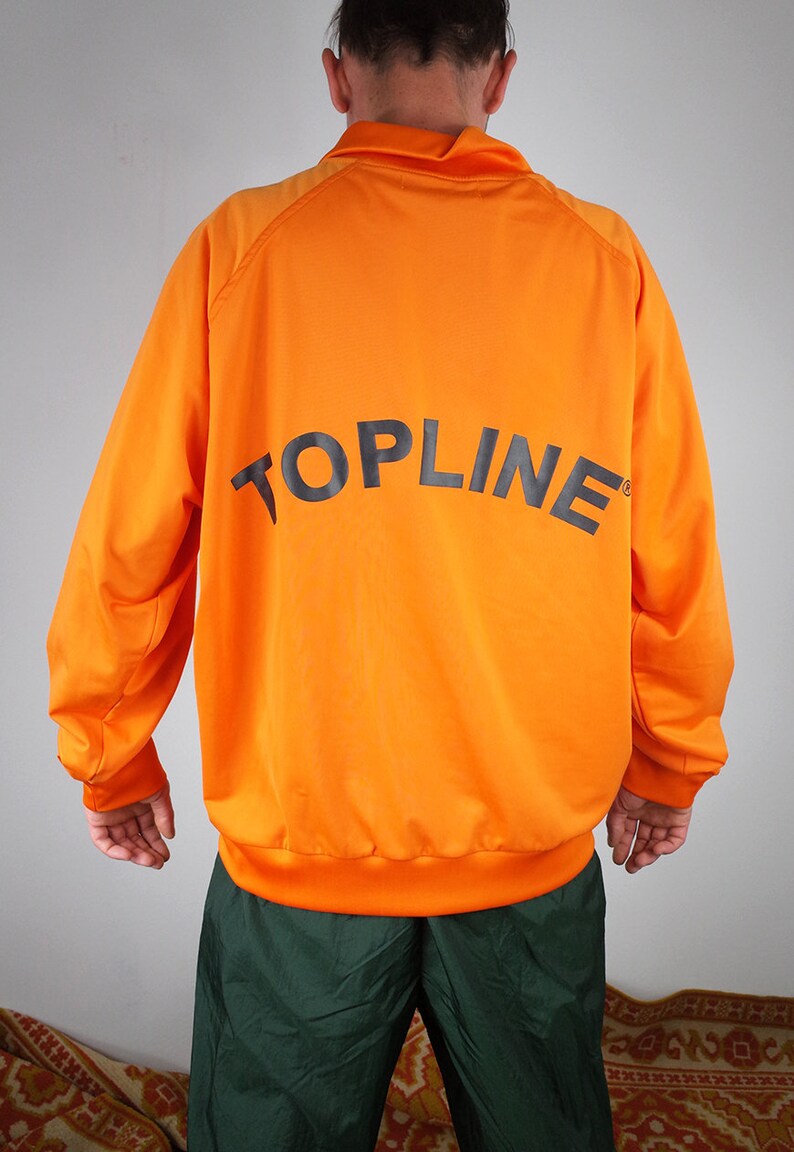 haut de survêtement vintage, veste de survêtement, coupe vent vintage des années 90, survêtement zippé orange, veste de jogging sport de gymnastique, haut de survêtement vintage, veste de survêtement, coupe vent vintage des années 90, survêtement zippé orange, veste de jogging sport de gymnastique,