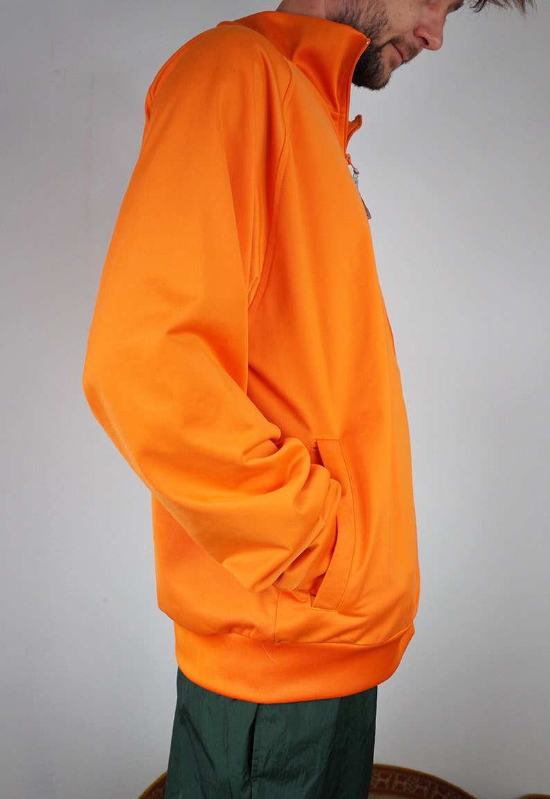 haut de survêtement vintage, veste de survêtement, coupe vent vintage des années 90, survêtement zippé orange, veste de jogging sport de gymnastique, haut de survêtement vintage, veste de survêtement, coupe vent vintage des années 90, survêtement zippé orange, veste de jogging sport de gymnastique,