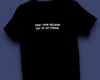 May include: Black t-shirt with white text that reads "Keep your religion out of my uterus."