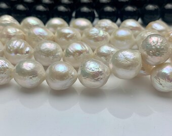 May include: A strand of white baroque pearls with an iridescent sheen. The pearls are round and have a slightly irregular shape.