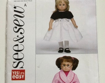 May include: A sewing pattern package featuring two doll outfits. One doll wears a black top, white skirt, and black shoes. The other doll is in a pink robe, pants, and slippers. The package has the text "see & sew" and "YES! It's easy".