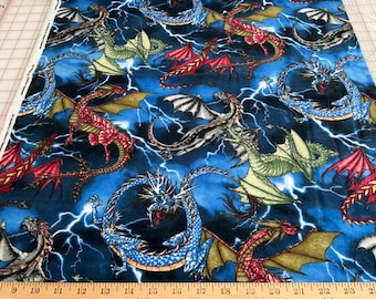 Flannel/Dragons on blue background cotton fabric