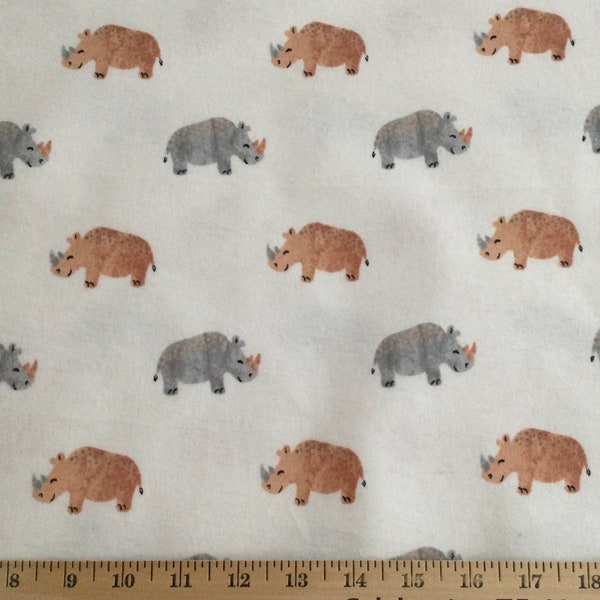 Flannel/Rhinos on off-white background cotton fabric