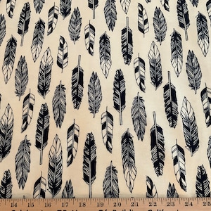 Flannel/Feather sketches on beige background cotton fabric
