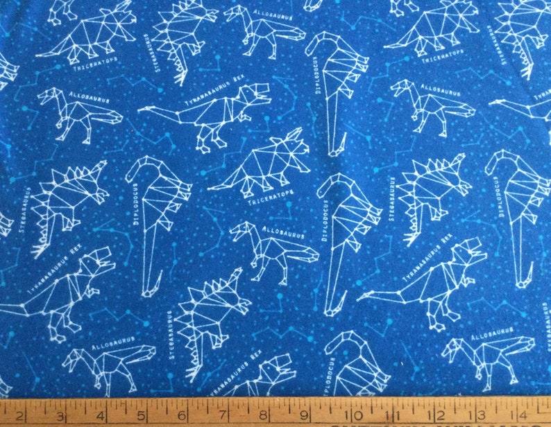 FlannelDinosaur theme on blue background cotton fabric by the yard