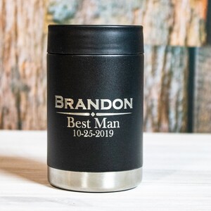 May include: Black insulated can cooler with the name "BRANDON" engraved in silver lettering, along with the words "Best Man" and the date "10-25-2019".