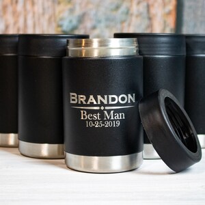 May include: Six black and silver insulated beverage holders with a black lid. One holder is engraved with the text "BRANDON Best Man 10-25-2019".
