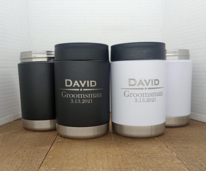 May include: Three stainless steel insulated tumblers with black and white lids. The tumblers are engraved with the name "DAVID" and the text "Groomsman 3.13.2021".