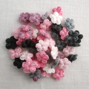 Set of 33 tiny crochet woolen flowers