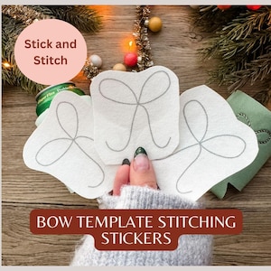 May include: White bow template stickers with gray stitching are displayed. The stickers are held by a person wearing a gray sweater. The image also includes text that reads "Stick and Stitch" and "BOW TEMPLATE STITCHING STICKERS".