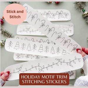 May include: A set of white adhesive embroidery stabilizer strips featuring black line art patterns of holiday motifs including bows, candy canes, string lights, pine trees, and snowflakes, labeled Stick and Stitch.