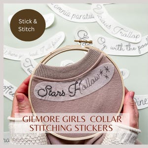 May include: A set of white fabric stickers with black embroidery for stitching on a collar. The stickers feature the text "Stars Hollow" and "Gilmore Girls Collar Stitching Stickers".