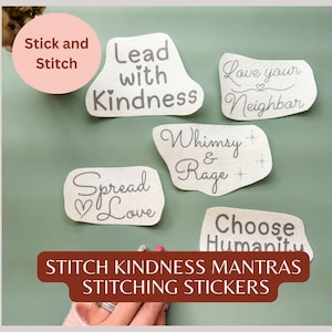 May include: A collection of off-white, irregularly shaped stickers with handwritten phrases like "Lead with Kindness" and "Spread Love." The stickers are displayed on a green background, with the text "STITCH KINDNESS MANTRAS STITCHING STICKERS" at the bottom.