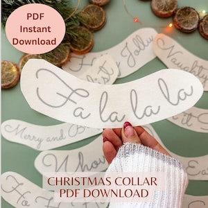 May include: A white curved paper cutout featuring the gray cursive text Fa la la la. This item is part of a collection of printable Christmas collar designs, presented as a digital PDF instant download for crafting holiday accessories.