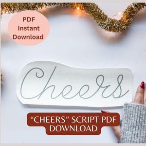 May include: A light gray script design that says "Cheers" on a white background. The words are in a cursive font. The image also includes a pink circle with the words "PDF Instant Download" and a brown rectangle with the words "Cheers Script PDF Download".