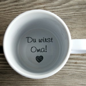 Tasse Du wirst Oma, Kaffeetasse, Schwangerschaftsankündigung, Schwangerschaftsanzeige, Unterseite, versteckte Botschaft, geheime Botschaft zdjęcie 1