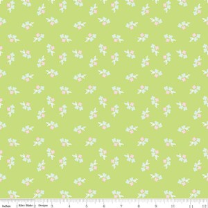 May include: A lime green fabric with a repeating pattern of small floral clusters. Each cluster features pink and light blue flowers with white stems and leaves. The fabric is suitable for quilting and other craft projects.