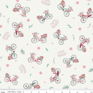 May include: A white fabric with a repeating pattern of pink and green bicycles with baskets filled with flowers. The bicycles have red wheels and are set against a white background with small pink flowers and green leaves.