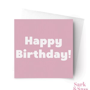 May include: A square, pink birthday card with the words "Happy Birthday!" in bold, white letters. The card is paired with a white envelope. The Etsy shop name "Sark & Sass" is in the bottom right corner.