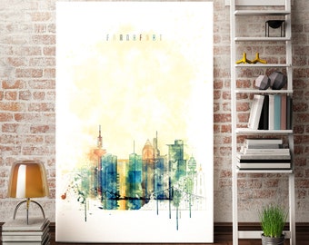 May include: A watercolor painting of the Frankfurt skyline with the word "FRANKFURT" at the top. The painting is in shades of blue, green, yellow, and orange.