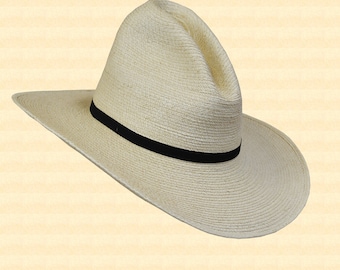 May include: A white straw cowboy hat with a black band around the crown.