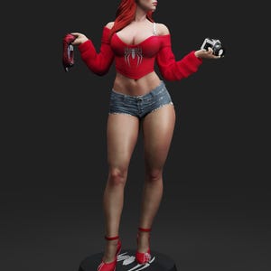 May include: A figurine of a woman with red hair, wearing a red off-the-shoulder top with a spider emblem, denim shorts, and red heels. She holds a camera and a Spider-Man mask. The figurine is on a black base.