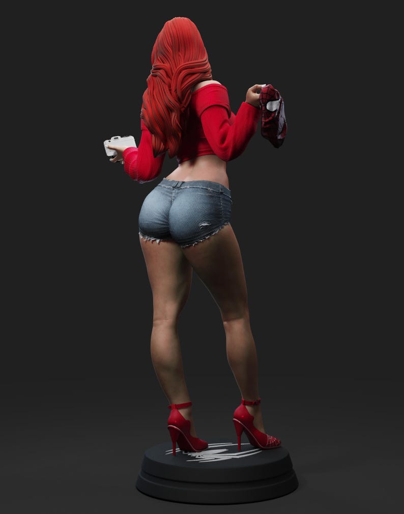 May include: A figurine of a person with long red hair, wearing a red off-the-shoulder top, denim shorts, and red high heels. The figure is holding a small white object and a red and black object. The figurine is standing on a black base.